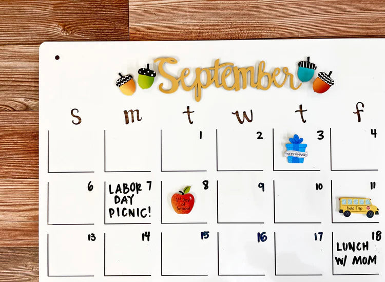 A September calendar with magnets on different days. 