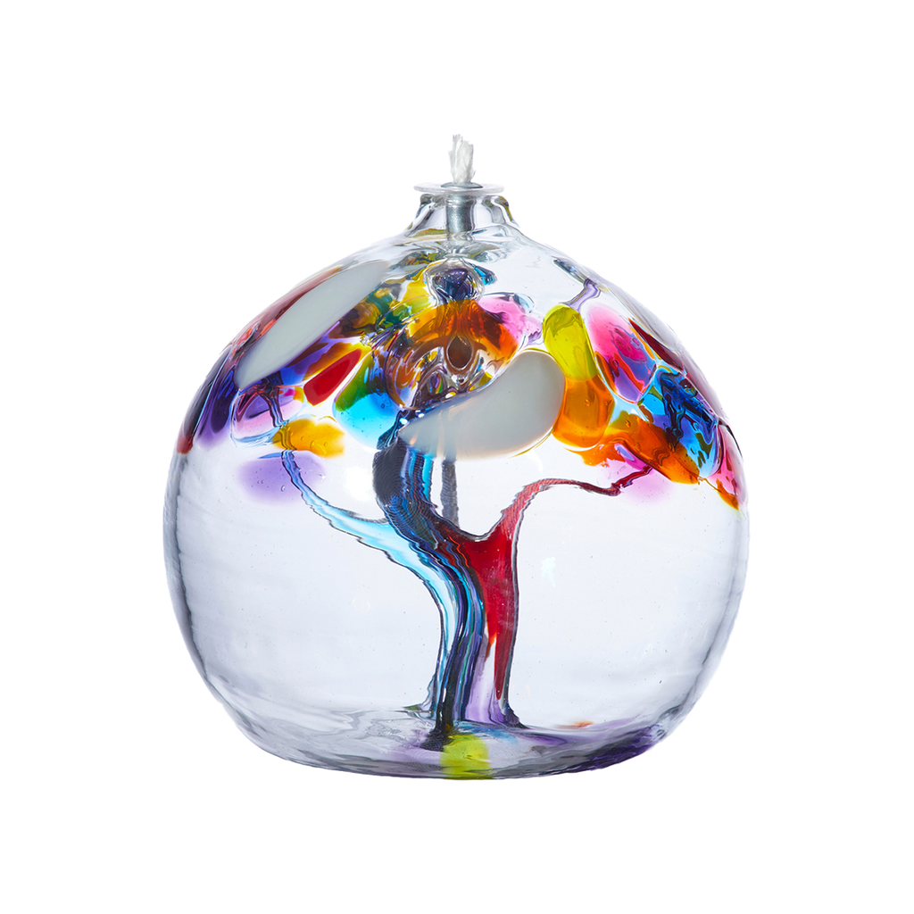 Clear glass flat bottom orb with a wick with pink and blue glass pulled through the middle and white, blue, pink, orange, yellow and purple bits on top on a transparent background.