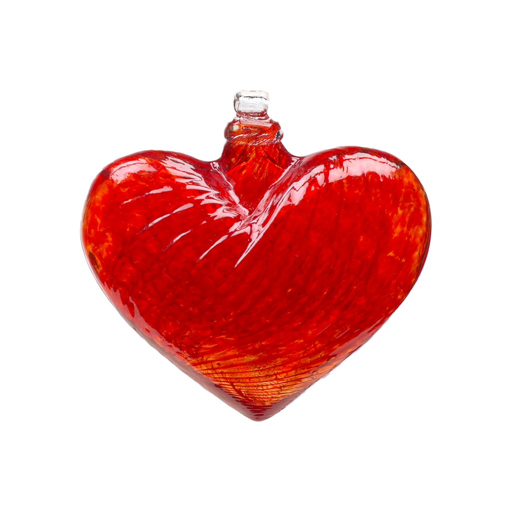 Red glass heart on a transparent background.