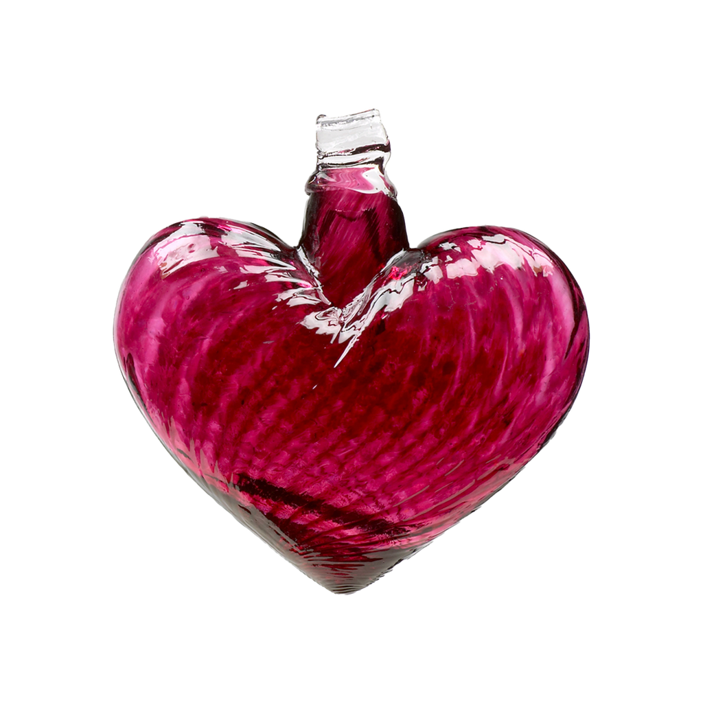 Pink glass heart on a transparent background.