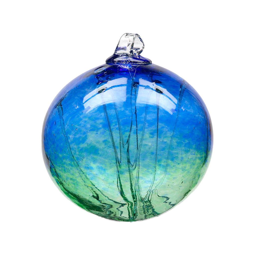 Glass orb with blue glass on top and green glass on the bottom and webbing pulled from bottom to top on a transparent background.