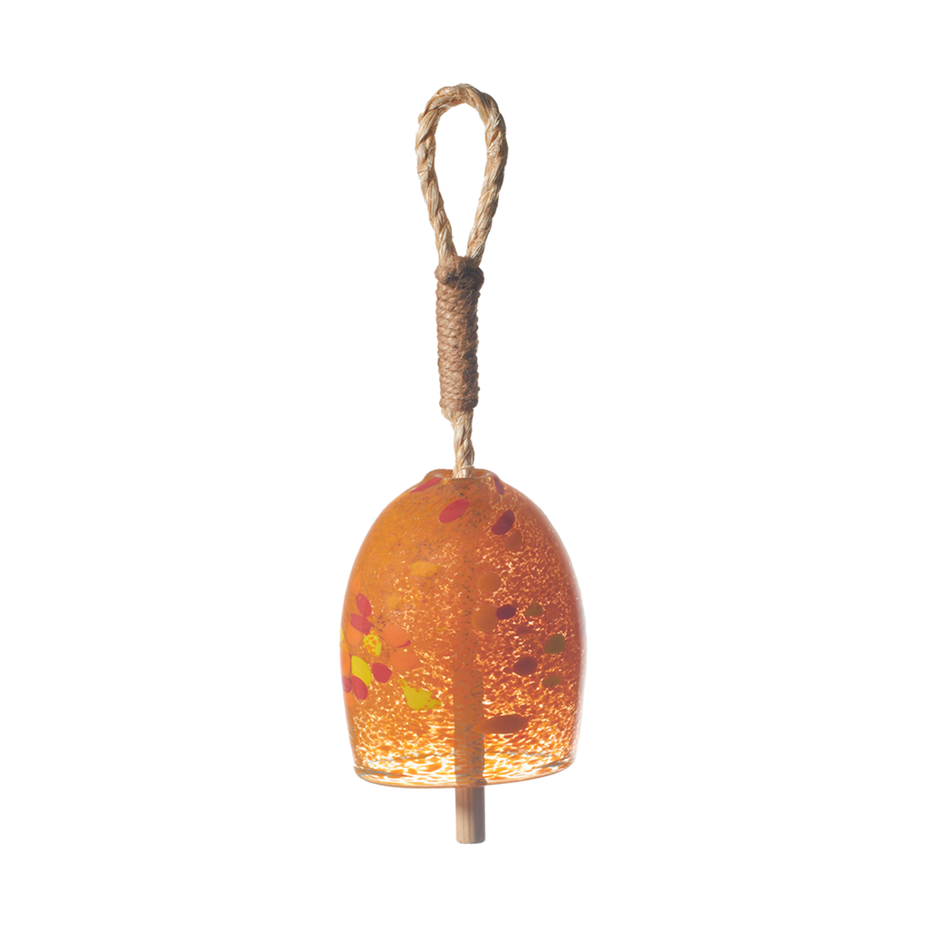 Opaque orange bell with red and yellow spots with a rope and wood toggle on a transparent background.