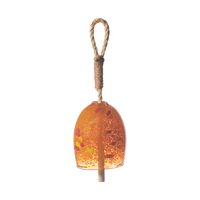Opaque orange bell with red and yellow spots with a rope and wood toggle on a transparent background.