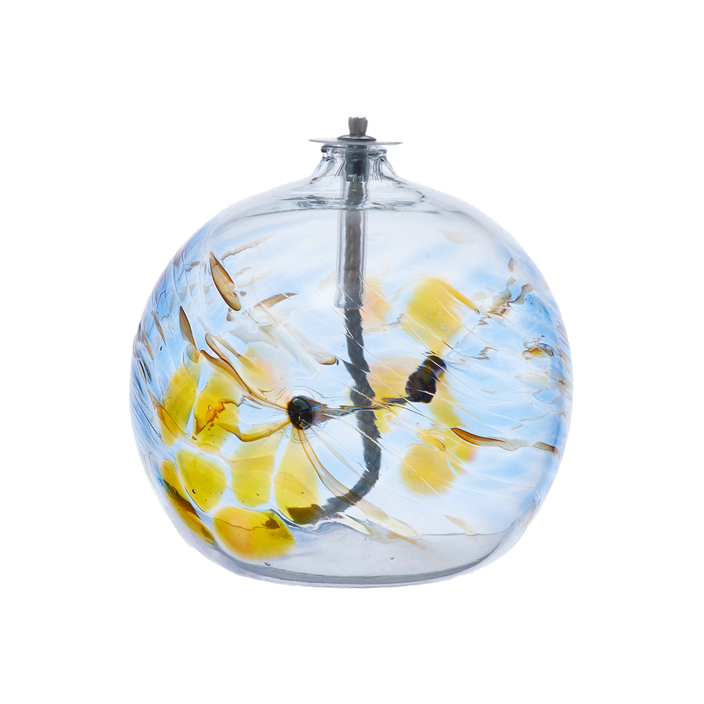 Flat-bottomed glass orb with a wick with yellow, red and blue coloured glass around the middle and horizontal webbing on a transparent background.