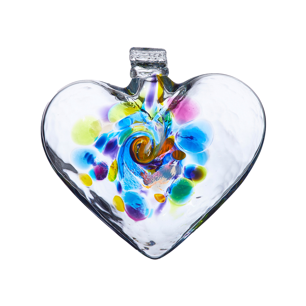 Clear glass heart with blue, lime, purple, pink and opaque white glass swirled in the centre on a transparent background.