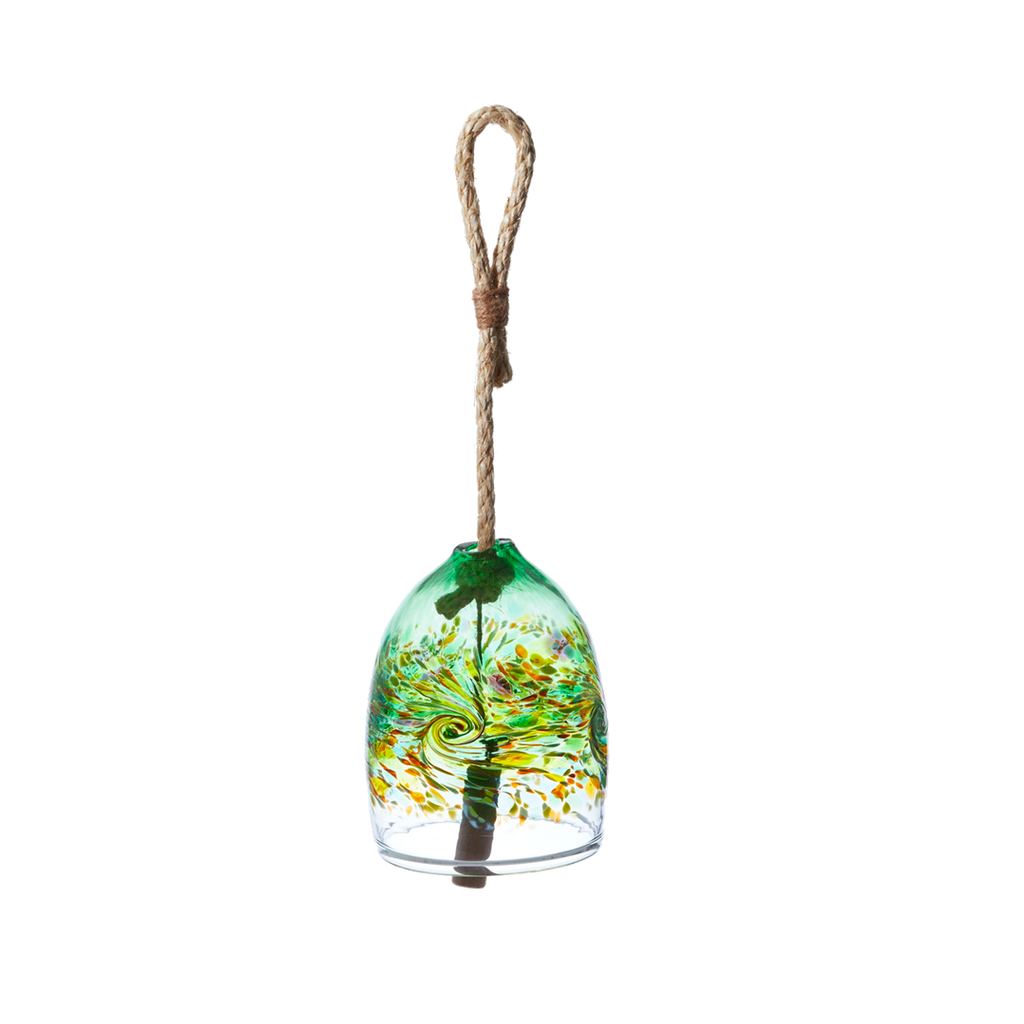 A clear glass bell with green, opaque lime, orange and purple glass swirled across the middle. A wooden toggle and rope are pulled through the middle on a transparent background
