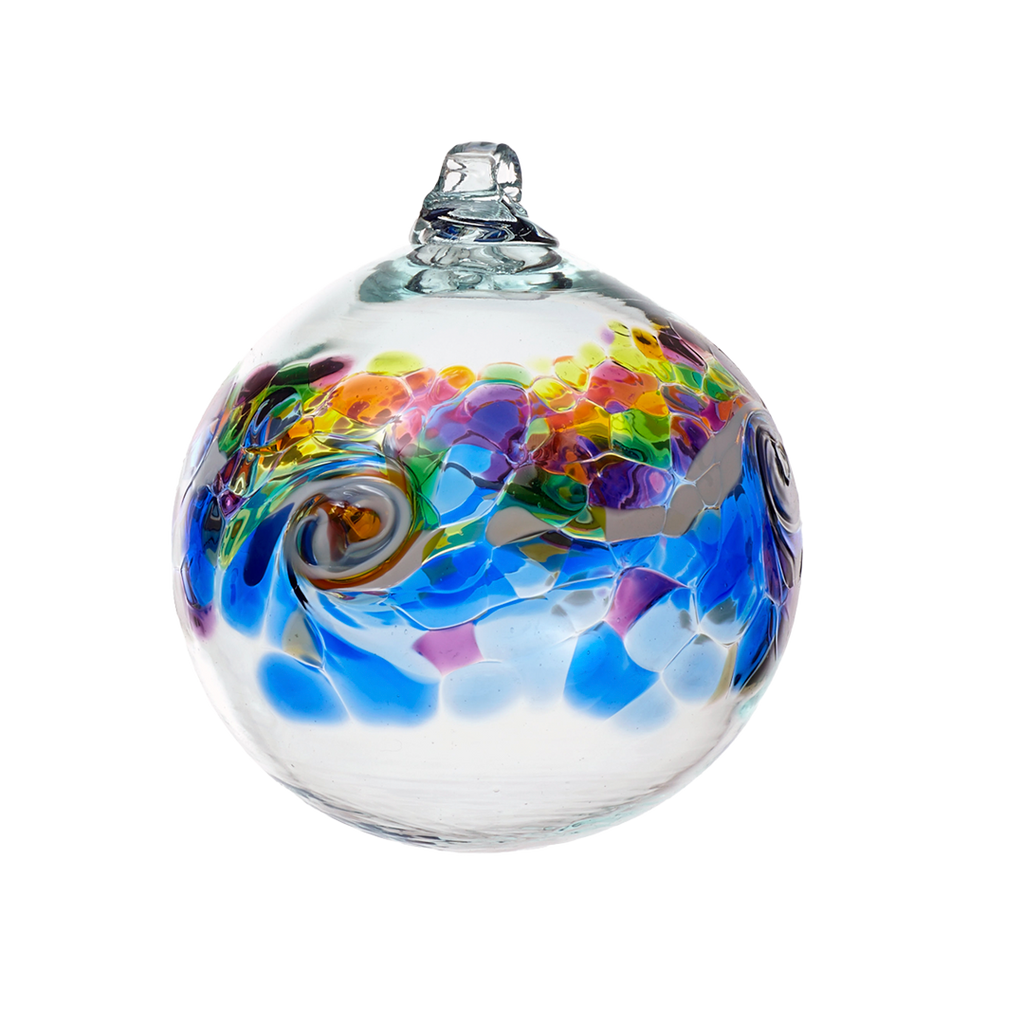 Glass orb with a band of colour around the middle. Yellow, pink, red, orange and greem on top, a white band of opaque glass swirled in the middle and blue and purple glass below on a transparent background
