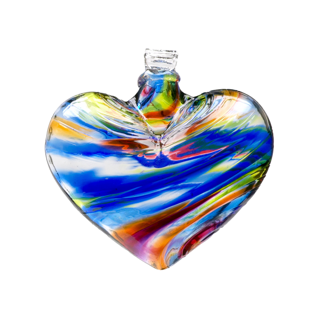 Glass heart with blue, orange, pink, lime and red mosaiced around the entire surface on a transparent background.