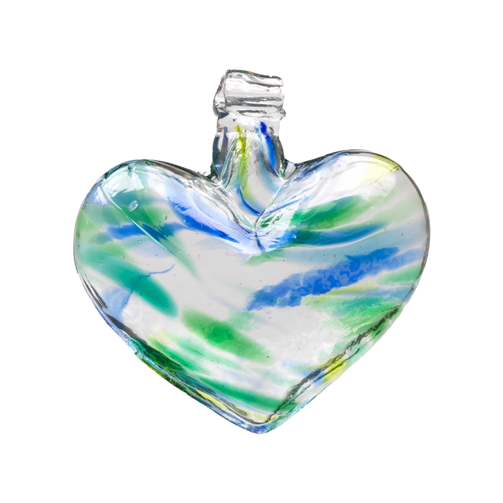 Glass heart with green, blue and lime mosaiced around the entire surface on a transparent background.