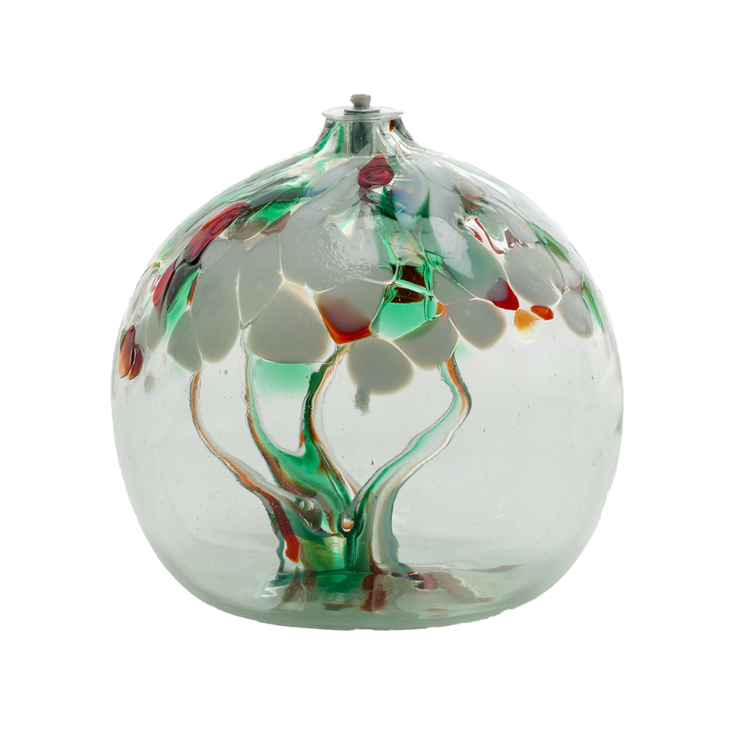 Clear glass flat bottom orb with red, green and clear glass pulled through the middle and white, red, green and gold glitter bits on top on a transparent background.