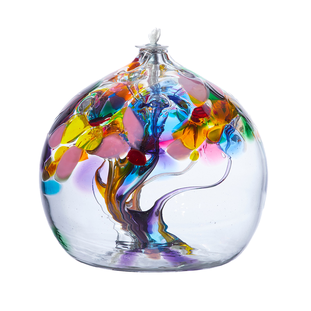 Clear glass orb with orange, purple and blue glass pulled through the middle and yellow, purple, pink, orange, green, gold glitter and blue bits on top on a transparent background.