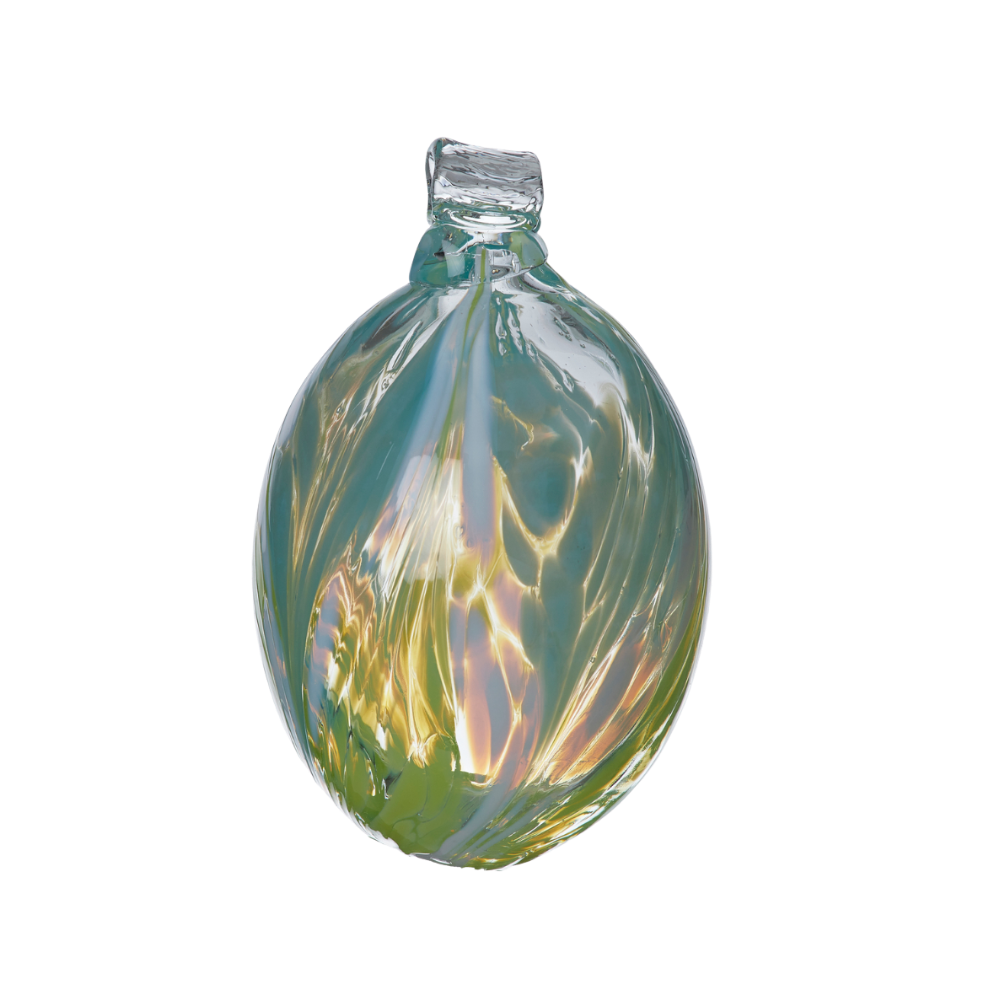 Oval glass orb covered with opaque glass. Blue on top, white in the middle and lime on the bottom on a transparent background.