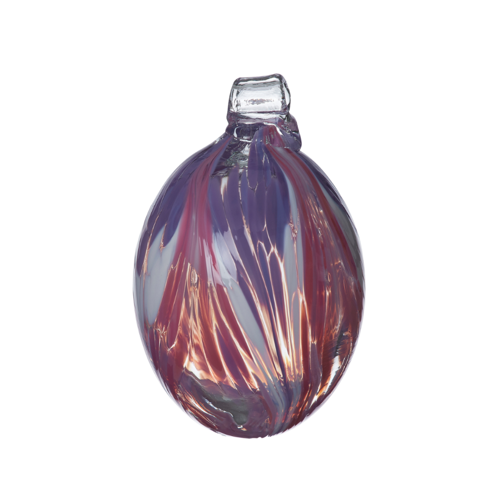 Oval glass orb covered with opaque glass. Purple on top, white in the middle and pink on the bottom on a transparent background.