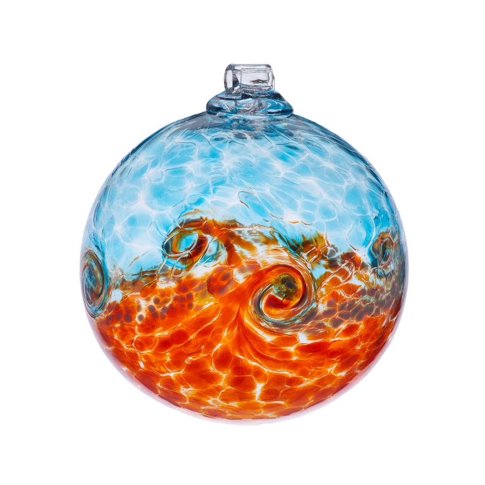 Glass orb with blue on top, white swirled across the middle, and orange on the bottom on a transparent background. 