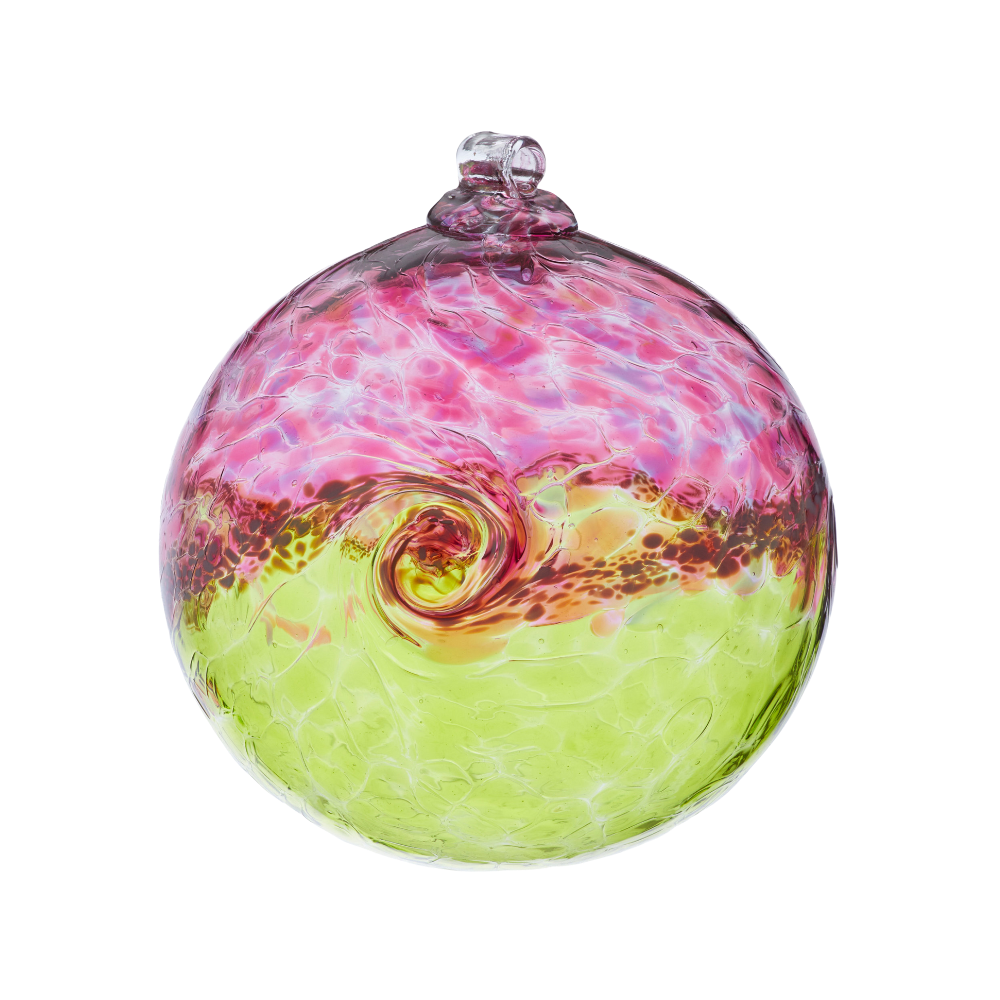 Glass orb with pink on top, white swirled across the middle, and lime on the bottom on a transparent background. 