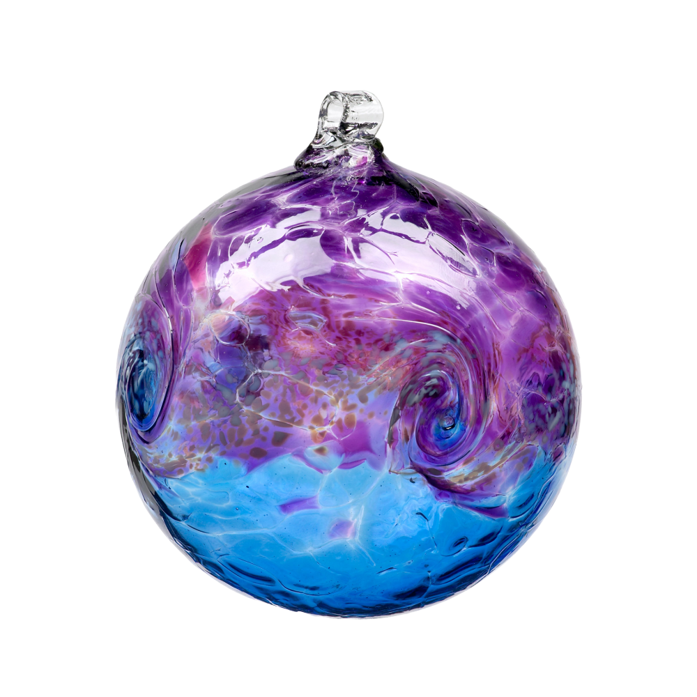 Glass orb with purple on top, white swirled across the middle, and blue on the bottom on a transparent background. 