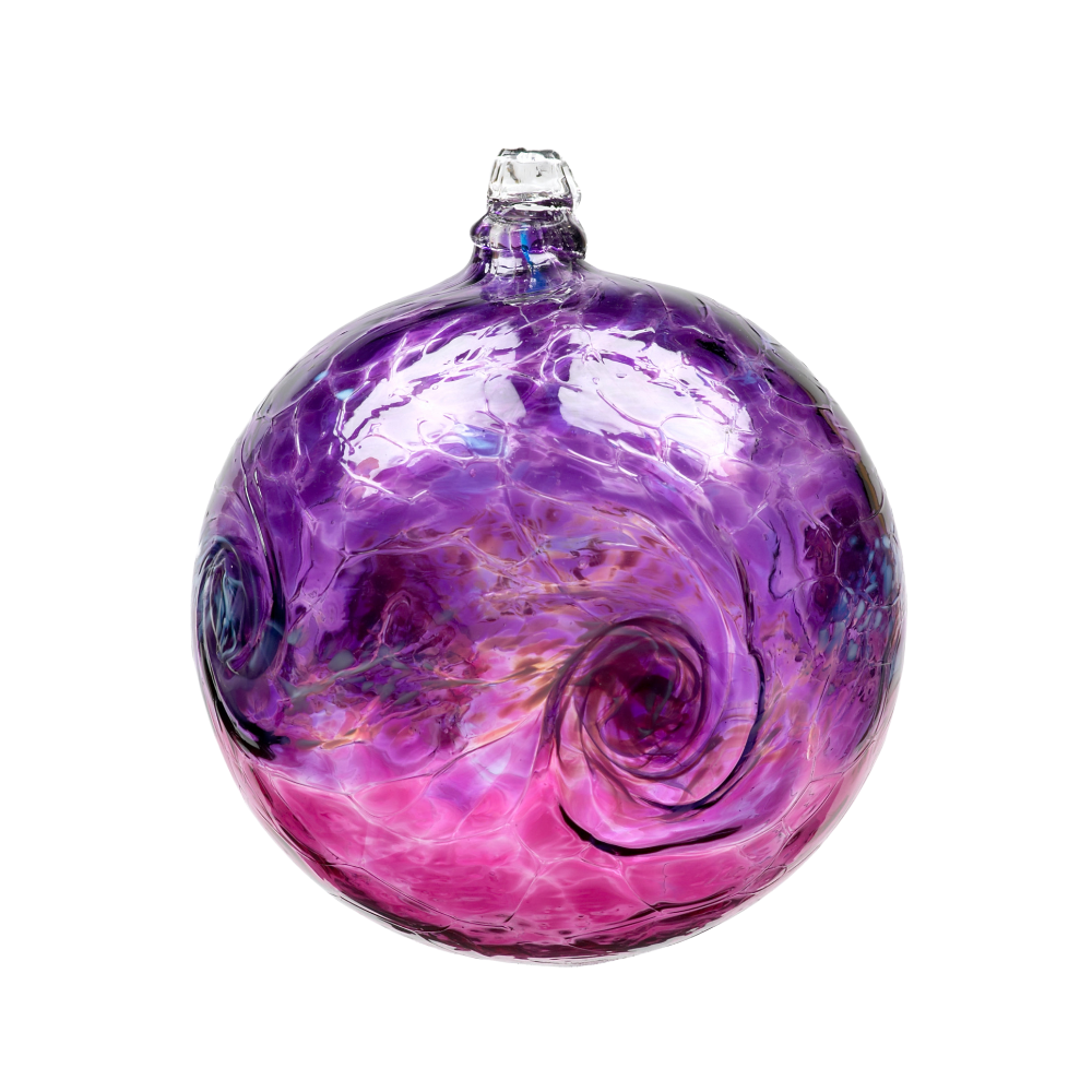 Glass orb with purple on top, white swirled across the middle, and pink on the bottom on a transparent background. 
