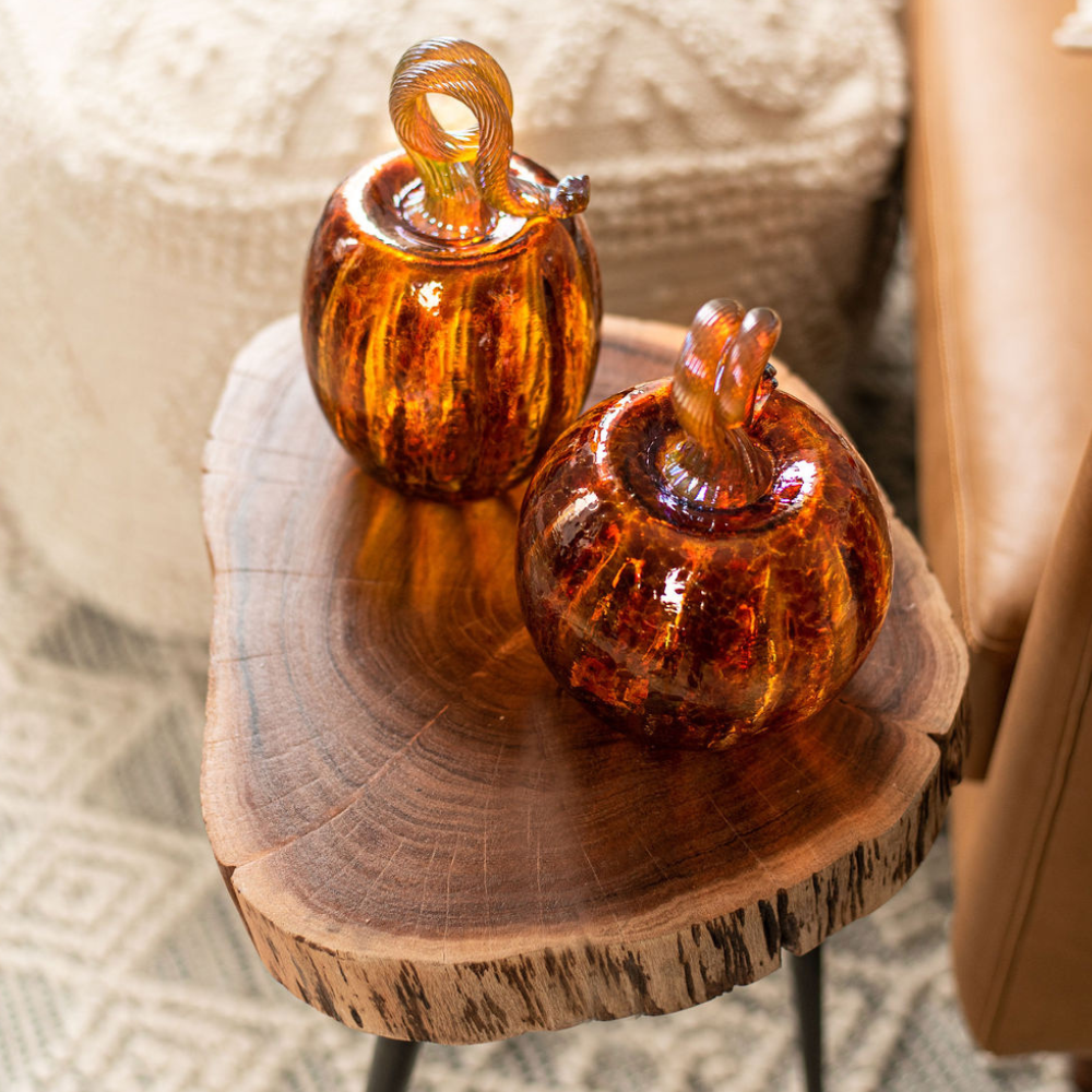 Oval and 6" Rust Round Pumpkin on a wooden table. 