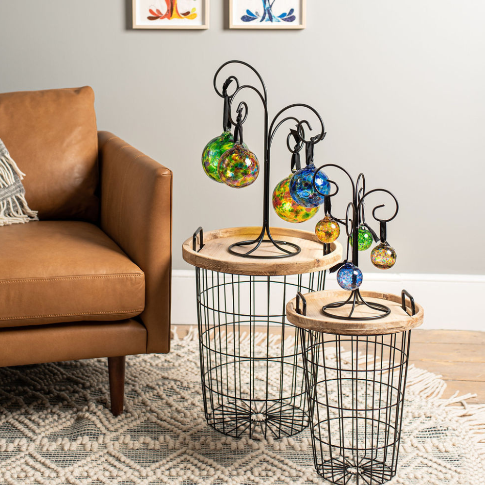Large and Small Quadruple Ornament Stands displaying 6", 3" and 2" Calico Balls on end tables. 