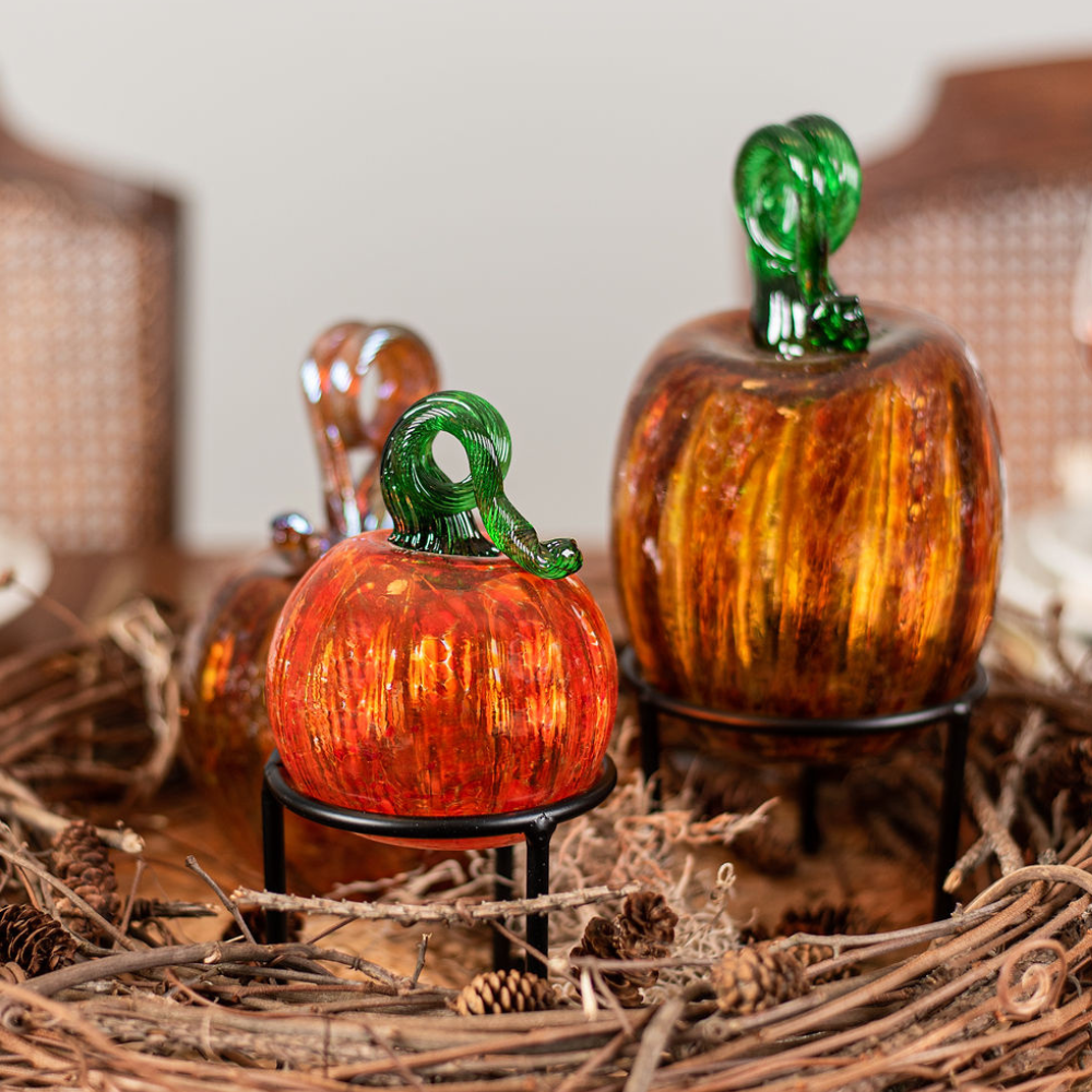 3" Round Orange Pumpkin and Oval Rust Pumpkin displayed on Tree Leg Stands, in the middle of a wreath.