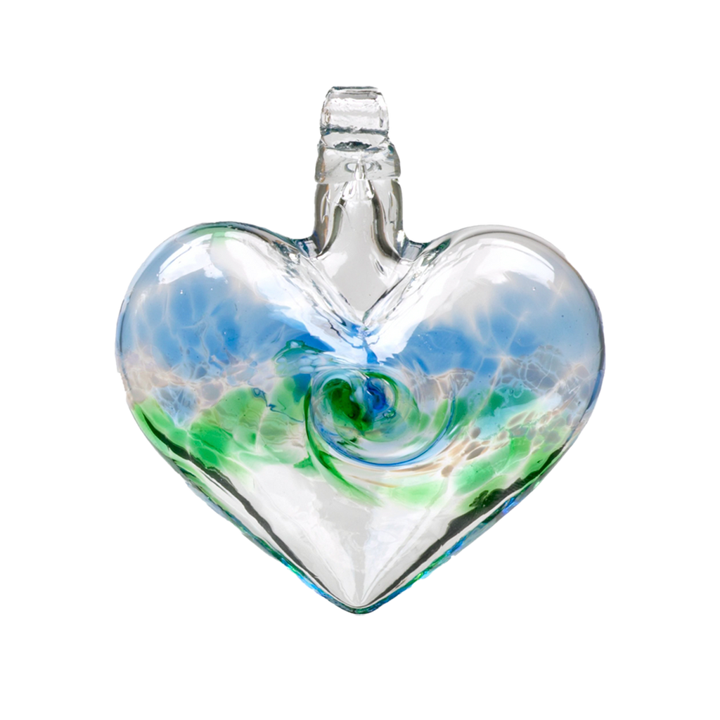 Glass heart with blue on top, white swirled across the middle and green on the bottom on a transparent background.
