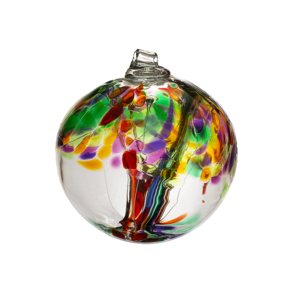 Clear glass orb with red and purple glass pulled through the middle and yellow, red, purple, pink, orange and green glass bits on top on a transparent background.