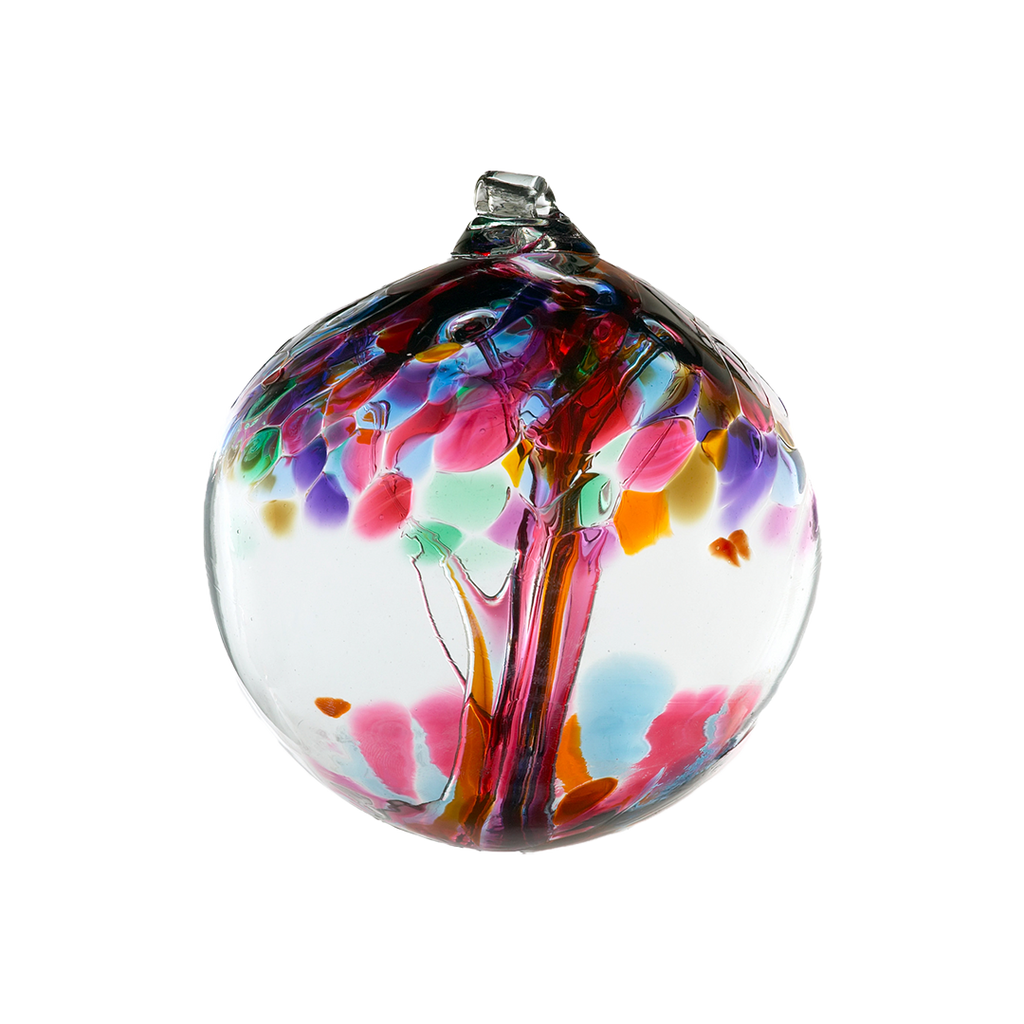 Clear glass orb with pink glass pulled through the middle and Purple, Pink, Orange, Green, Blue and Amber glass bits on top on a transparent background. 