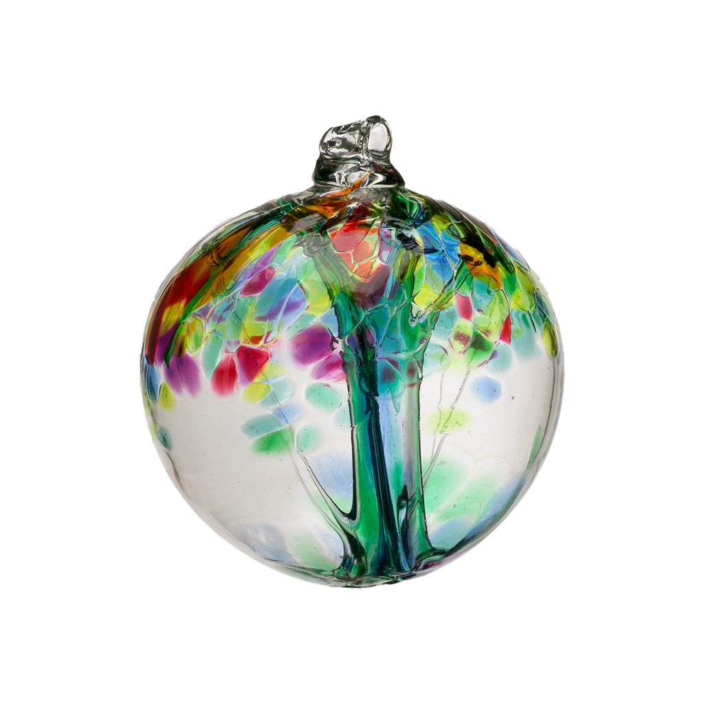 Clear glass orb with green glass pulled through the middle and red, green, lime, blue and pink glass bits on top on a transparent background. 