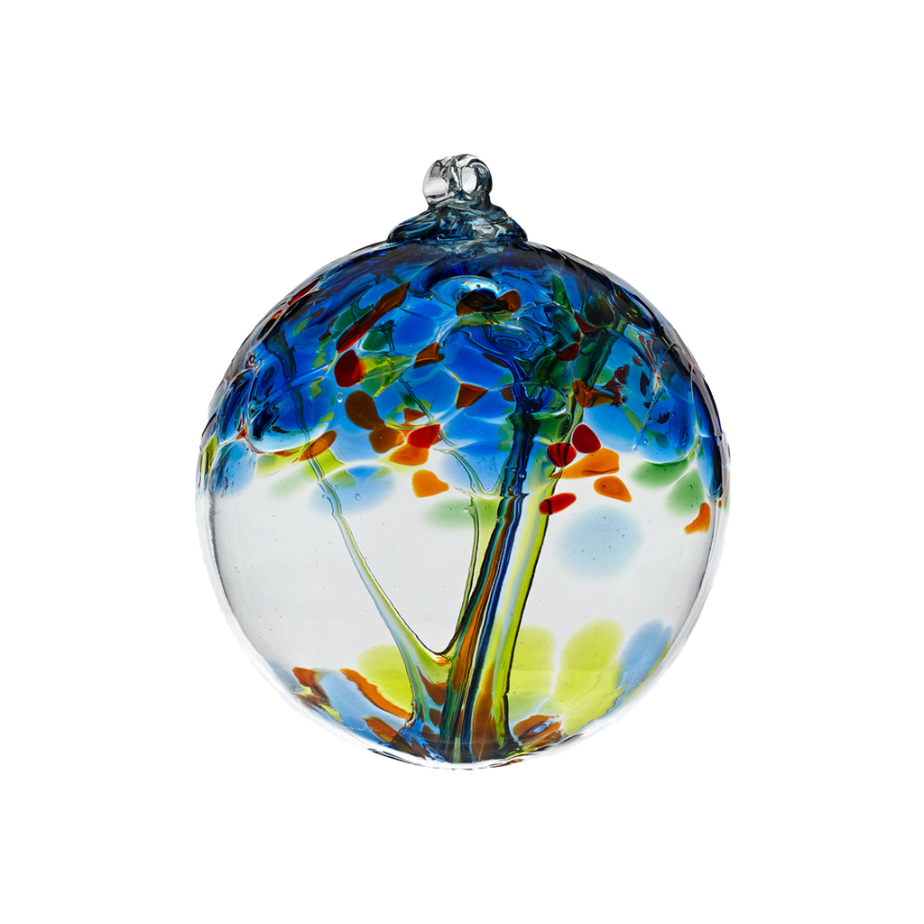Clear glass orb with lime and blue glass pulled through the middle and blue, aqua, lime green and orange bits on top on a transparent background.