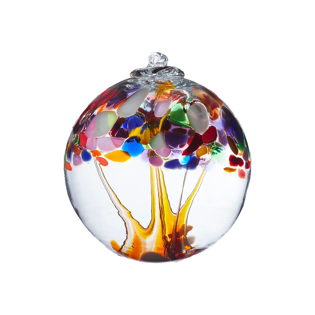 Clear glass orb with orange glass pulled through the middle and Opaque White, Pastel Pink, Amethyst, Cobalt, Amber, Orange, Opaque Red, Green and Brown bits on top on a transparent background.