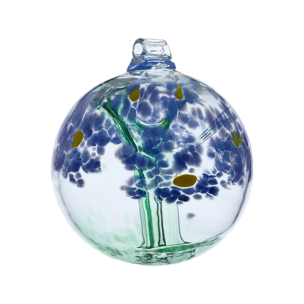 Clear glass orb with a green stem pulled from bottom to top to a canopy of blue opaque glass blossoms and orange centres on a transparent background.